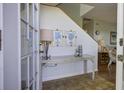 Bright entryway with tiled floor, console table, and view into living area at 32 Marsh Island (4 Shares) Ln, Isle of Palms, SC 29451