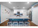 Modern kitchen with granite countertops, stainless steel appliances, and white cabinets at 671 Silver Spruce St, Summerville, SC 29486