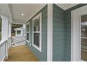 Wooden deck with white railings and two windows at 790 Maynard Ln, Summerville, SC 29486