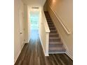 Bright entryway with hardwood floors and a staircase leading upstairs at 1802 Scarlett Maple St, Summerville, SC 29486