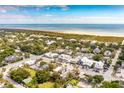 Aerial view of coastal town with beach and houses at 2220 Ion Ave, Sullivans Island, SC 29482