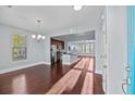 Bright dining room with hardwood floors and an open view to the kitchen at 313 Oakbend St, Summerville, SC 29486