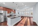 Modern kitchen with stainless steel appliances and a granite countertop island at 313 Oakbend St, Summerville, SC 29486
