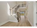 Elegant entryway with hardwood floors and a staircase leading to the second floor at 316 Trailmore Ln, Summerville, SC 29486