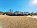 Brick home with covered porch at 388 E Main St, Harleyville, SC 29448