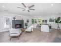 Bright living room with fireplace and hardwood floors, featuring comfortable seating at 738 Olney Rd, Charleston, SC 29414
