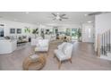 Spacious living room with hardwood floors and comfortable seating, open to kitchen at 738 Olney Rd, Charleston, SC 29414