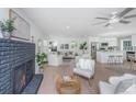 Cozy living room with fireplace and hardwood floors, featuring comfortable seating at 738 Olney Rd, Charleston, SC 29414