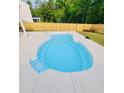 Freeform swimming pool with a concrete deck at 104 Belgian Ct, Summerville, SC 29486