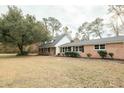 Ranch home with a large yard and mature trees at 106 Reardon Ave, Walterboro, SC 29488