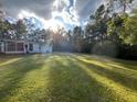 Spacious backyard with lush green grass at 211 Water Wheel Rd, Ridgeville, SC 29472