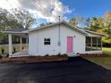 Home features a screened porch and large backyard at 211 Water Wheel Rd, Ridgeville, SC 29472