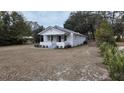 Cute bungalow with metal roof, newly landscaped yard and driveway at 220 Thompson St, Walterboro, SC 29488