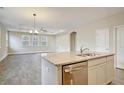 Open kitchen features an island with a sink and granite countertops at 244 Mcmakin Dr, Summerville, SC 29483