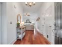 Bright entryway with hardwood floors and a rustic console table at 116 Hearthstone Cir, Goose Creek, SC 29445