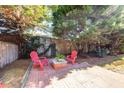 Small patio with red chairs and a fire pit at 1441 Waterside Ct, Mount Pleasant, SC 29464