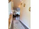 Long hallway with grey flooring and access to living room at 148 Pine Shadow Dr, Goose Creek, SC 29445