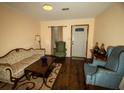 Living room featuring wood floors and comfy armchairs at 1905 Central Park Rd # B, Charleston, SC 29412