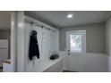 Bright entryway with built-in bench and storage at 412 Live Oak St, Walterboro, SC 29488