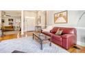 Living room with red leather sofa and a view of the foyer at 1358 Hidden Lakes Dr, Mount Pleasant, SC 29464