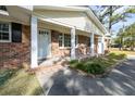 Brick front porch with white columns and landscaping at 301 Corey Blvd, Summerville, SC 29483
