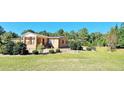 Brick home with covered porch and a large backyard at 3112 Santee River Rd, Saint Stephen, SC 29479