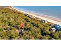 Aerial view showing home's location near beach and other houses at 456 Vetch Ct, Kiawah Island, SC 29455