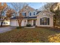 Two-story stucco home with a two-car garage and landscaped lawn at 7011 Windmill Creek Rd, Charleston, SC 29414