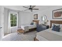 Bright bedroom with two twin beds and wood accents at 768 Maynard Ln, Summerville, SC 29486