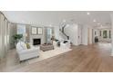 Spacious living room with hardwood floors, fireplace, and ample natural light at 1643 Cultivation Lane Dr # 450, Mount Pleasant, SC 29466