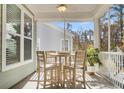 Screened porch with table and chairs perfect for dining at 206 River Martin Ct, Summerville, SC 29483