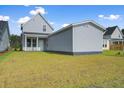 Spacious backyard with grass and a detached structure at 368 Trailmore Ln, Summerville, SC 29486