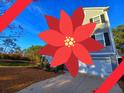 Charming two-story home with a two-car garage and driveway at 3510 Saltflat Ln, Mount Pleasant, SC 29466