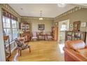 Home office with hardwood floors, built-in bookshelves, and antique furniture at 359 Clayton Dr, Charleston, SC 29414