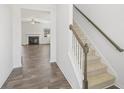 Inviting foyer with wood-look tile flooring and a staircase leading to the second floor at 773 Opal Wing St, Moncks Corner, SC 29461