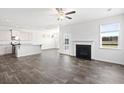 Open concept living area with a fireplace, kitchen island, and dining space at 773 Opal Wing St, Moncks Corner, SC 29461