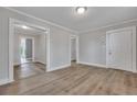 Open living area with wood-look floors and doorways to other rooms at 2675 Houston St, North Charleston, SC 29405
