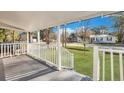 Covered front porch with white railing and views of the neighborhood at 2754 Houston St, North Charleston, SC 29405