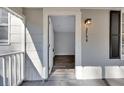 Front porch entryway leading into a room with wood-look flooring at 2754 Houston St, North Charleston, SC 29405