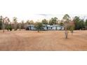 Ranch-style home with a metal roof and attached carport at 280 Royalegates Ct, Cross, SC 29436