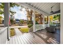 Relaxing front porch with seating, offering views of the neighborhood and fall foliage at 3699 Codorus Ct, Mount Pleasant, SC 29466