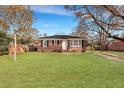 Single-story brick home with fenced yard and mature trees at 442 Annette Dr, Goose Creek, SC 29445