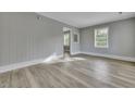 Bright living room with wood-look flooring and neutral gray walls at 442 Annette Dr, Goose Creek, SC 29445