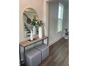 Welcoming foyer with an arched mirror, console table, and stylish decor at 112 Crosscut Ln, Summerville, SC 29486