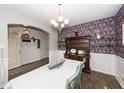 Dining area with floral wallpaper, wood hutch, and view of the entryway at 1526 Mcintosh Rd, Johns Island, SC 29455