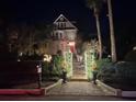 House exterior at night, decorated for the holidays at 208 Sumter Ave, Summerville, SC 29483