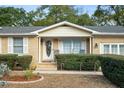 Brick front exterior of charming ranch home with a decorative wreath at 312 4Th Ave, Mount Pleasant, SC 29464