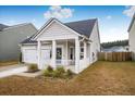 One-story house with a front porch and attached garage at 356 Garden Lily Ln, Summerville, SC 29485