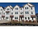 Three story townhome under construction, red roof, and brick accents at 5142 Double Eagle Lp, Summerville, SC 29485