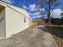 Side view of house, showing garage and driveway at 7024 E Constellation Dr, North Charleston, SC 29418